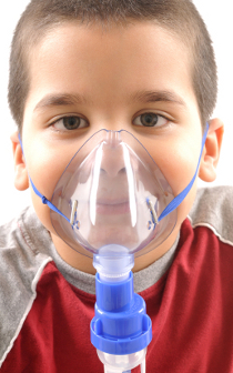 Boy wearing oxygen mask